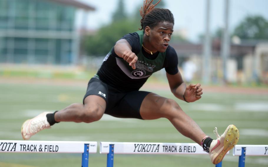 Pacific record-holder Carlos Cadet (14.61 seconds) of Kubasaki navigates the 110-meter hurdle preliminaries.