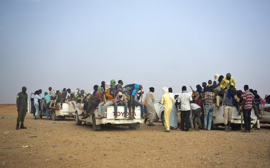 This June 14, 2018, file photo shows Nigeriens and third-country migrants head towards Libya from Agadez, Niger. 