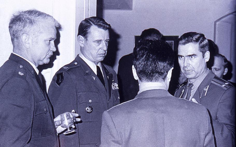 Retired U.S. Air Force Col. James Tonge, then a lieutenant colonel, far left, is seen here talking to his Soviet counterparts during a USMLM reception.