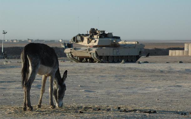 Hed: Beast of burden, 2005

Bi'aj, Iraq, Dec. 2, 2005: An Abrams tank from Apache Troop, First Squadron, 3rd Armored Cavalry Regiment takes position during a cordon and search operation December 2, 2005 in the town of Bi'aj in northwestern Iraq. The operation, which was planned by the Iraqi Army, was aimed at rooting out a suspected insurgent cell  within the hardscrabble hamlet.

Read the story about the operation here.
https://www.stripes.com/news/2005-12-06/iraqi-soldiers-plan-execute-search-in-small-town-of-biaj-1967983.html

META TAGS: Iraq; Operation Iraqi Freedom; OIF; War on Terror; U.S. military; war; combat; donkey; mule; U.S. Army