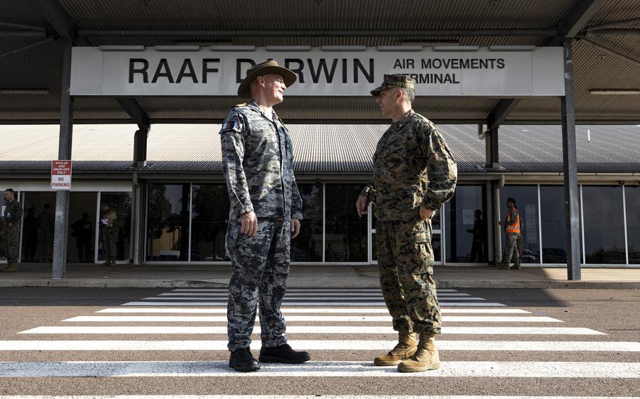 U.S. Marine Corps Col. Brian Mulvihill, right, meets Royal Australian Navy Capt. Mitchell Livingstone at Royal Australian Air Force Base Darwin, Australia, on March 24, 2024.