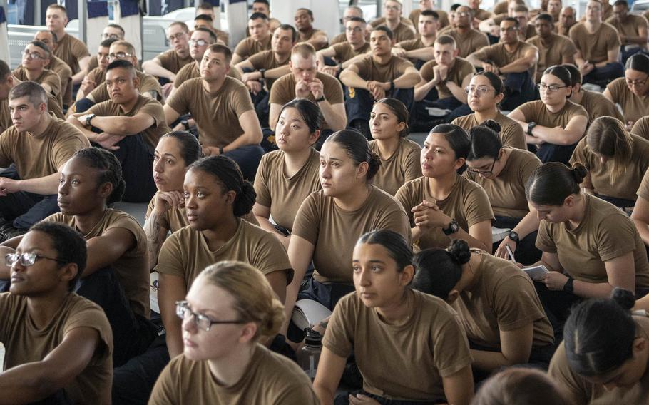 A crowd of recruits wearing brown T-shirts.