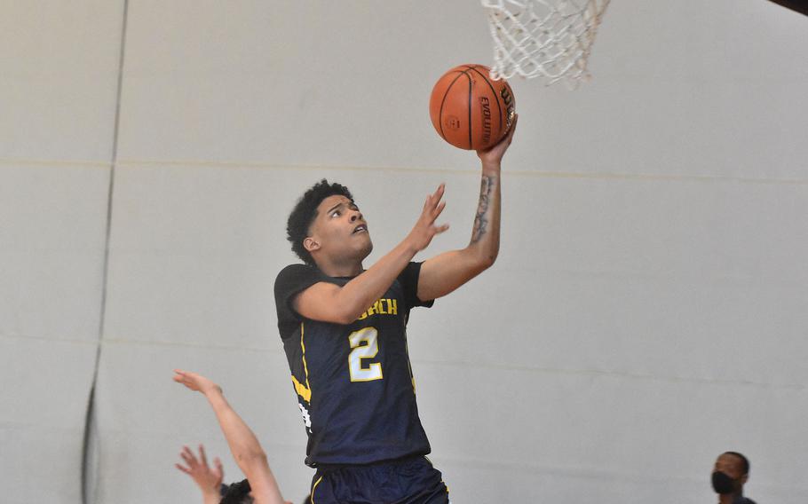 Ansbach's Shane Nesbitt goes up for a layup Wednesday, Feb. 23, 2022, in a 66-32 victory over AFNORTH on the opening day of the DODEA-Europe Division III basketball championships.