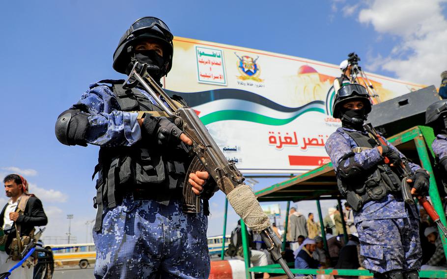 Members of Houthi security forces stand guard during a march in Yemen’s capital Sanaa on March 15, 2024, in support of Palestinians amid ongoing battles between Israel and the militant Hamas group in the Gaza Strip.