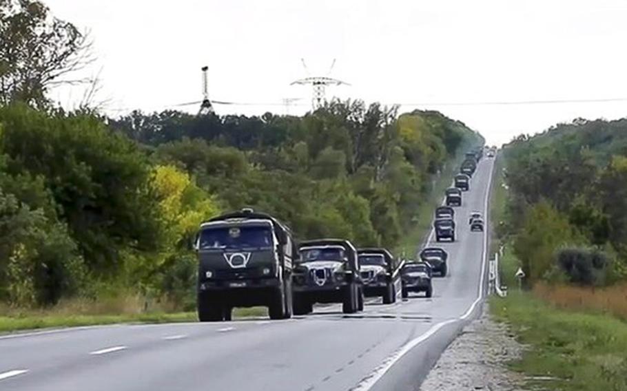 Russian military vehicles drive to the Kharkiv direction on a mission in Ukraine on Friday, Sept. 9, 2022. 