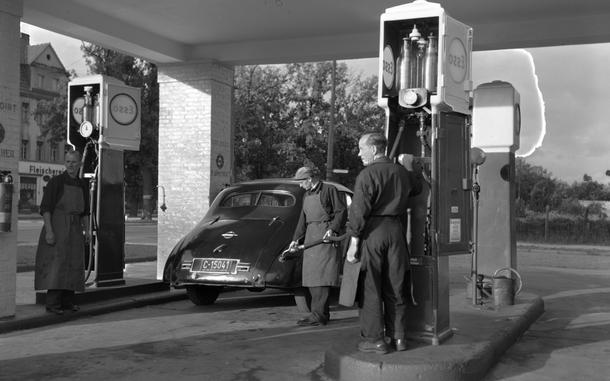 An American gets his montly ration of five gallons at the one-service station in Berlin still serving privately-owned vehicles due to the Berlin Blockade.