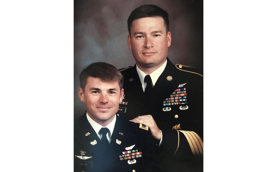 Twin brothers Kevin, right, and Keith Yoakum at Kevin’s reenlistment in the mid-1990s.