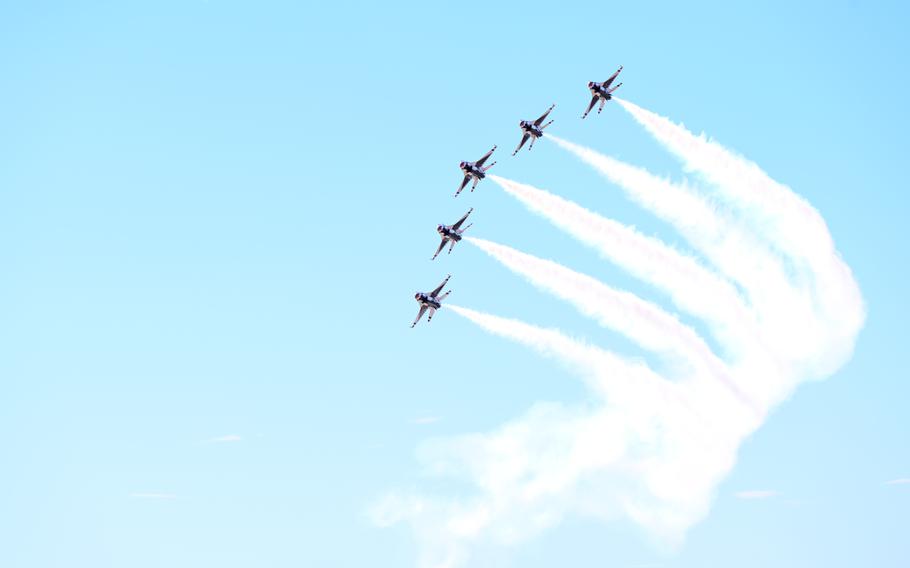 Five aircraft fly in formation in the sky