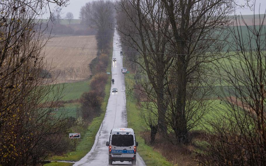 A police vehicle drives near the site where a missile strike killed two men in the eastern Poland village of Przewodow, near the border with war-ravaged Ukraine on Nov. 16, 2022. 