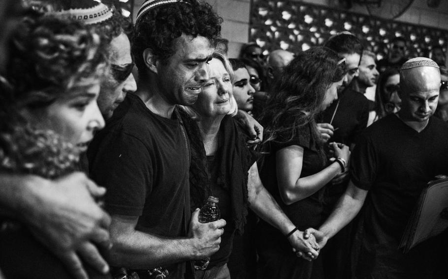 The family of Kim Demati, who was killed by Hamas militants, at her funeral in the town of Gadara, Israel, on Oct. 12, 2023. 