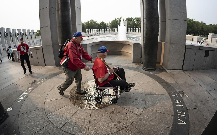 Participants in an Honor Flight from Kansas tour the National World War II Memorial in Washington, D.C., on the 79th anniversary of the start of the D-Day invasion, Tuesday, June 6, 2023.