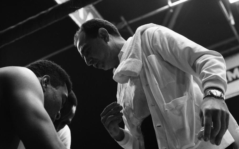 Muhammad Ali and trainer Angelo Dundee in between rounds of Ali's title fight against German boxer Karl Mildenberger in the ring at the Waldstadion in Frankfurt. 