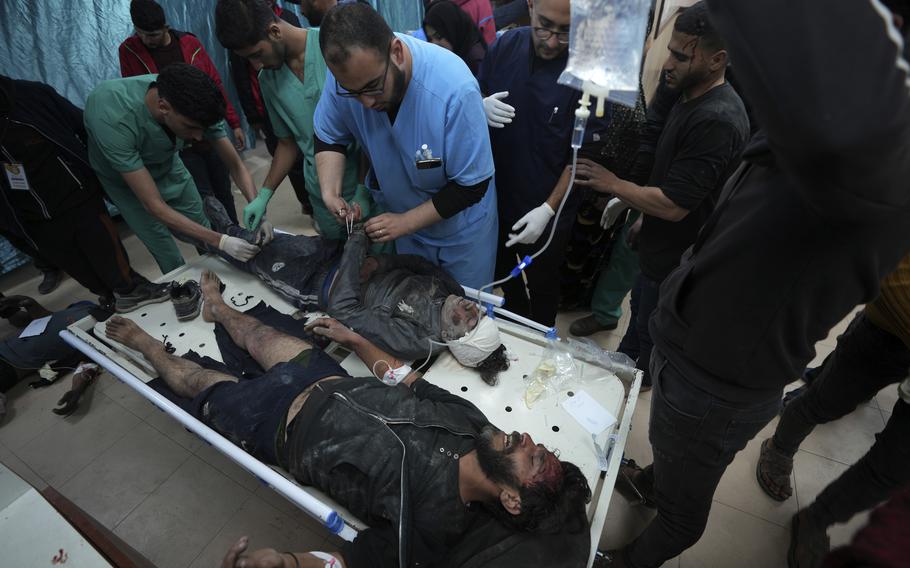 Palestinians wounded in the Israeli bombardment of the Gaza Strip are treated in a hospital in Deir al Balah, Gaza Strip, on Saturday, Feb. 10, 2024. 