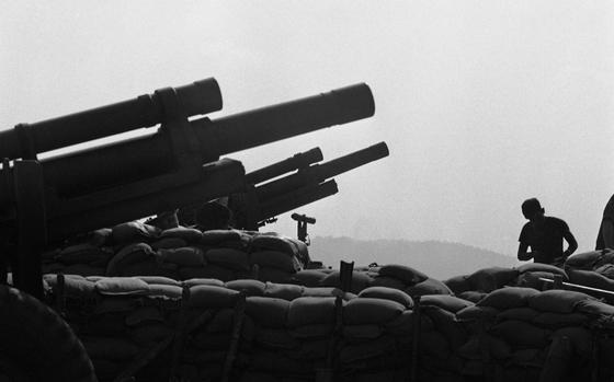 Dak To, South Vietnam, Mar. 11, 1968: Artillery piece at Fire Support Base 25 overlooking the Cambodian border of Vietnam is one of many hill-top FSBs around Dak To. Together with the men from the surrounding FSBs, the men of FSB 25 - Company A, 3rd Battalion, 12th Infantry Division and 6th Battalion, 29th Artillery Division - cover the whole Dak To Bowl - the small, unnamed valley in which Dak To is located. FSB 25 came under an intense mortar, rocket and ground attack January 31st in which nine men of 3/12 were wounded.

Looking for Stars and Stripes’ coverage of the Vietnam War? Subscribe to Stars and Stripes’ historic newspaper archive! We have digitized our 1948-1999 European and Pacific editions, as well as several of our WWII editions and made them available online through https://starsandstripes.newspaperarchive.com/

META TAGS: Pacific; South Vietnam; war; combat; U.S. Army; Infantry; servicemen; soldier; combat; artillery; cannon; sandbags; Howitzer; Tet offensive