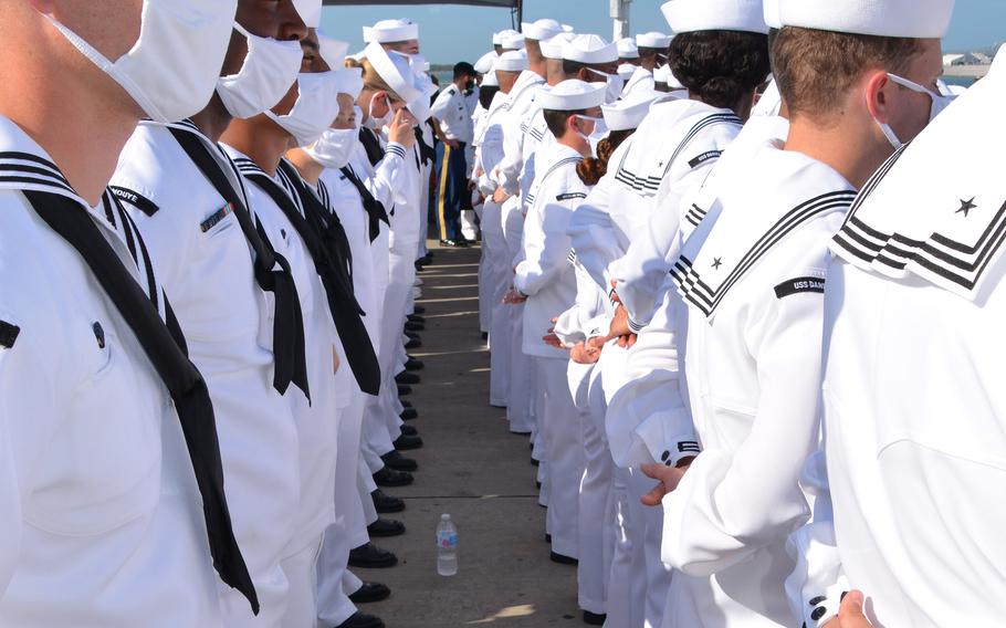 Crew members of the USS Daniel Inouye watch as the guided-missile destroyer is commissioned at Joint Base Pearl Harbor-Hickam, Hawaii, Wednesday, Dec. 8, 2021. 