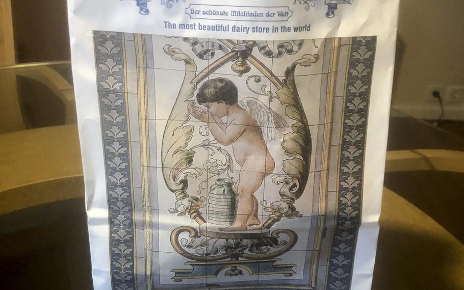 The shopping bag given to customers at Pfunds Molkerei features artwork similar to that found  in the store.