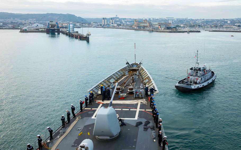 The cruiser USS Normandy pulls into Cherbourg harbor, in its namesake region of France, while underway as part of the Gerald R. Ford Carrier Strike Group, Nov. 14, 2022.