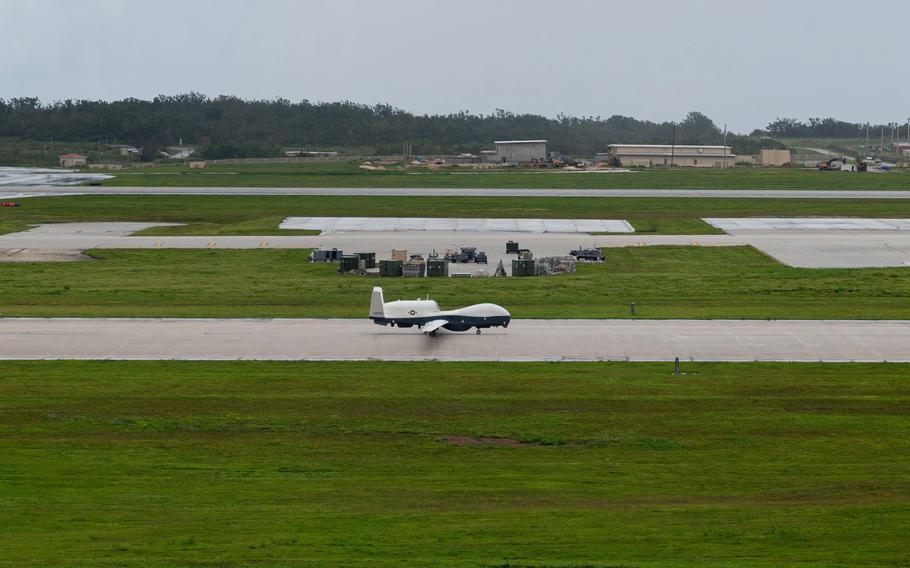 A U.S. Navy MQ-4C Triton taxis on an airfield.