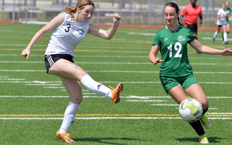 Vicenza’s Maya Fitch shoots on goal past Naples’ Sabrina Elrod  in the Division II girls final at the DODEA-Europe championships at Ramstein, Germany, May 18, 2023. The Wildcats beat the Cougars 3-1 in the all-Italy final.