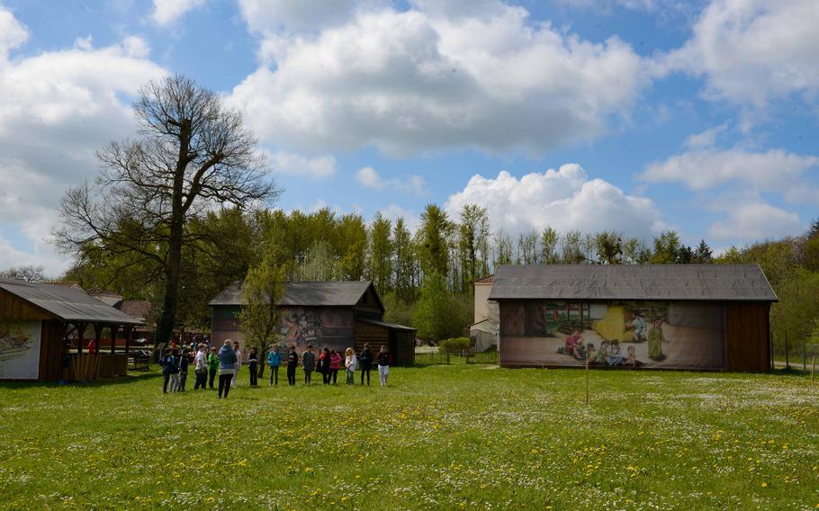 School groups gather on the lawn outside Roman Villa Borg to learn about the life of ancient Romans on May 2, 2023. The villa in the German town of Borg offers presentations on Roman pottery making and blacksmithing techniques. 