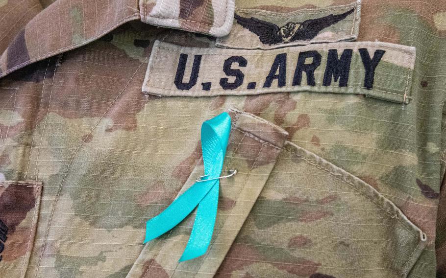 A soldier wears a teal ribbon symbolizing sexual assault awareness and prevention at Wheeler Army Airfield, Hawaii, in 2021. An Army-commissioned study released Feb. 27, 2023, recommended that commanders be briefed on how the variety of sexual assaults occurring in the Army differ from those of college campuses, despite similar demographics.