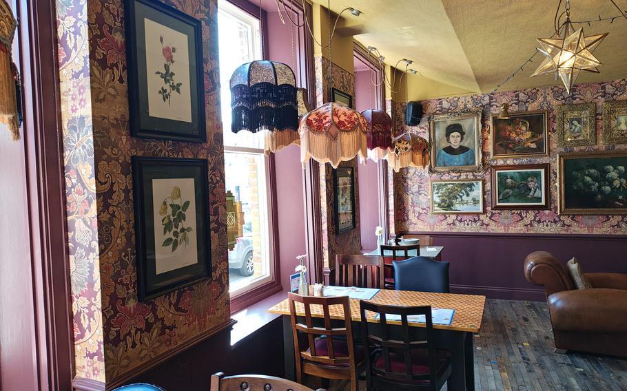 An inside view of Potro Lounge, with tables and chairs.