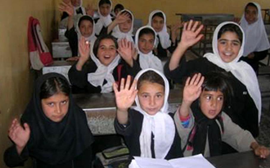 Students thank U.S. troops for the school built for them in Shadi Jam, a town in the Afghan province of Herat, in a photo taken during Sean Gustafson's deployment there from 2006-2007. Gustafson, a U.S. Army major at the time, said the Taliban capture of Herat on Aug. 12, 2021 surprised him.       