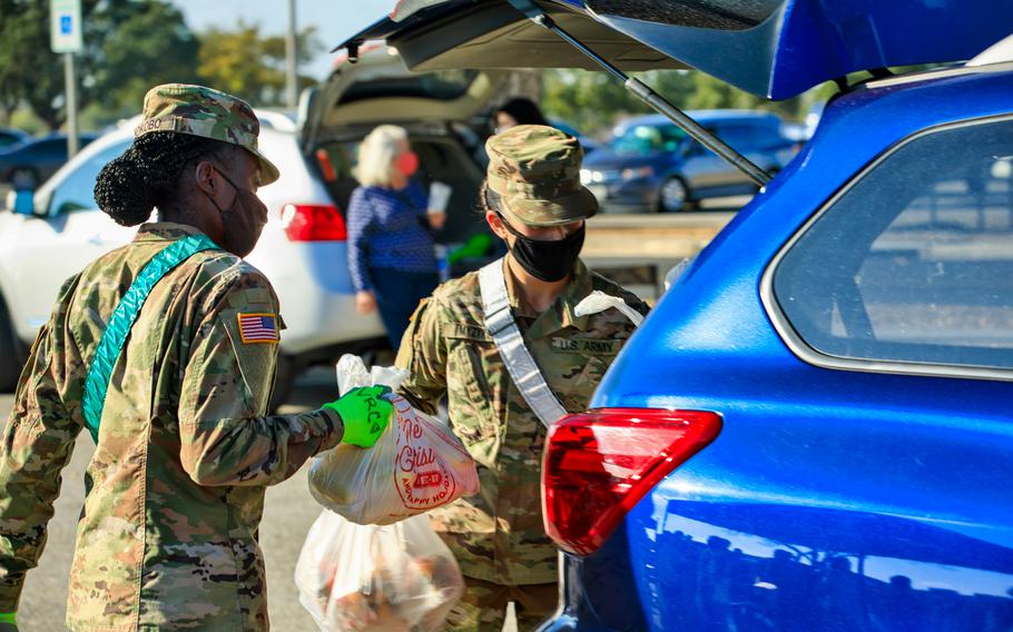 Soldiers from Alpha Company, 188th Medical Battalion, 32nd Medical Brigade volunteer at the Vogel Resiliency Center Pop-Up Food Bank Market at Joint Base San Antonio — Fort Sam Houston, Texas, Nov. 23, 2020.