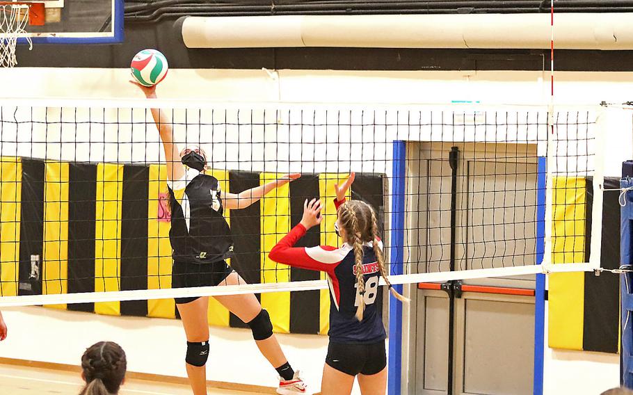 Vicenza's Shalom Dejardin goes up for a kill during the DODEA-Europe Division II girls volleyball championship game played at Vicenza. Vicenza won 25-19, 25-23, 20-25, 26-24.