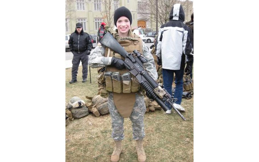 Elizabeth Dobbins Moskowitz displays an unloaded weapon when she was a 20-year-old sophomore at Virginia Military Institute.