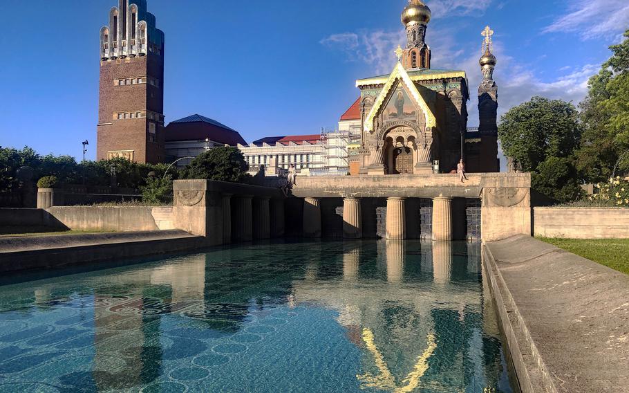 The Mathildenhoehe, featuring the Wedding Tower, an exhibition hall and the Russian Orthodox Church of St. Mary Magdalene, is the main tourist attraction in Darmstadt, Germany. Nearby is the Biergarten, a popular watering hole for locals and tourists alike.