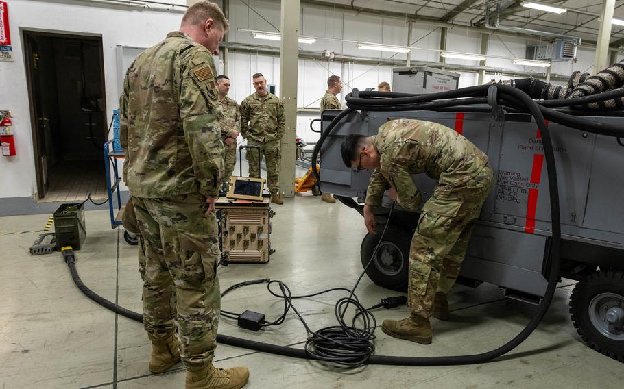 Col. Jason Purdy, 52nd Maintenance Group commander, left, receives a Project Weapon demonstration from Airman 1st Class Joel Martinez at Spangdahlem Air Base, Germany, Jan. 23, 2024.