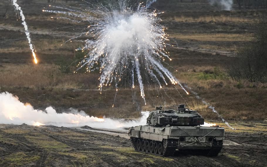 A Leopard 2 tank in action at the Bundeswehr tank battalion 203 at the Field Marshal Rommel Barracks in Augustdorf, Germany, Wednesday, Feb. 1, 2023. 