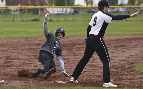 Wiesbaden sophomore Tyler Truesdell slides while stealing third base in a game against Spangdahlem in Wiesbaden, Germany on April 20, 2024.