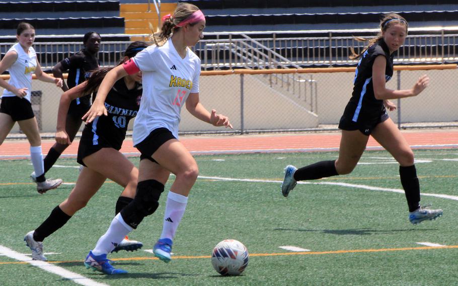 Kadena's Sydney Pontious scored the equalizer in the second half; Victoria Justice of Kinnick, right, had the match's first goal. The Panthers won the semifinal in penalties.