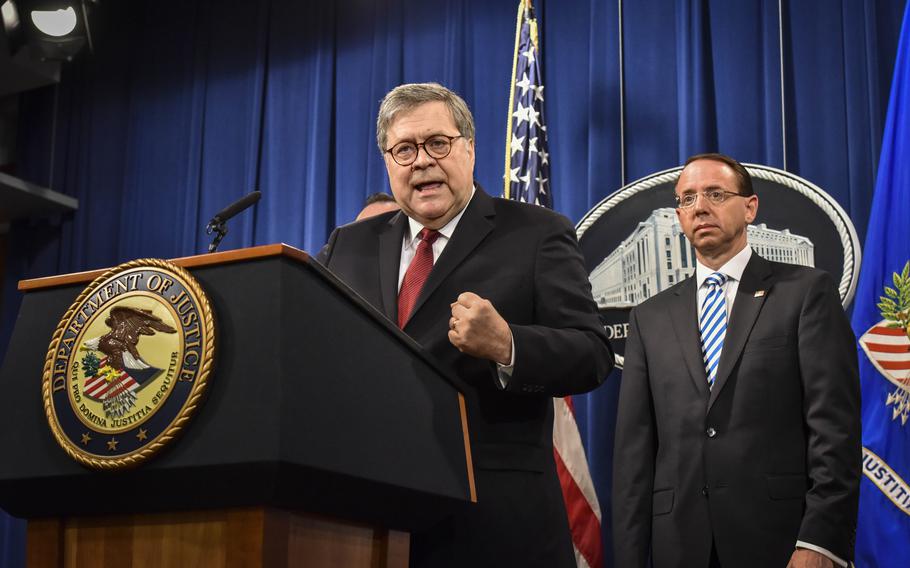 Attorney General William P. Barr, left, speaks during a news conference hours before releasing a redacted version of the Mueller report on April 18, 2019. Deputy Attorney General Rod J. Rosenstein is behind him at right.