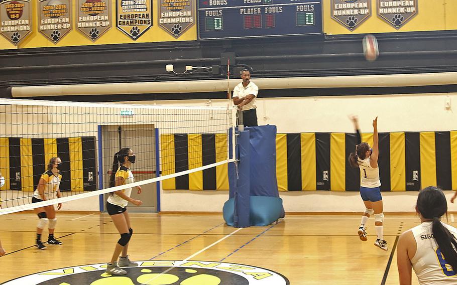 Madison Wood of the Sigonella Jaguars attempts to return the ball over to the Vicenza Cougars side during Saturday's game at Vicenza High School. The Cougars won in straight games, 25-12, 25-12, 25-10. 