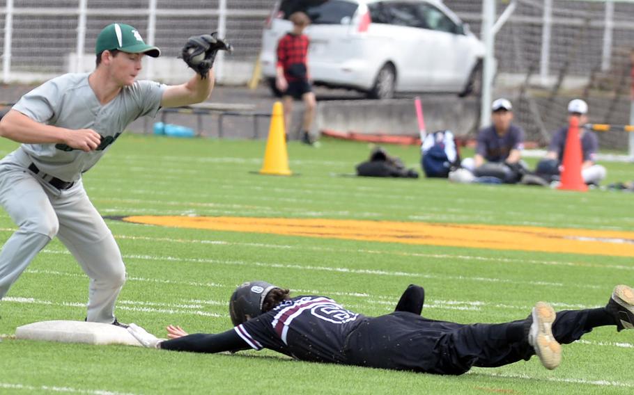 Zama‘s Blaeson Moore dives into second base ahead of the throw to Kubasaki’s Lukas Gaines in Friday’s first of four games for the Dragons in 24 hours.