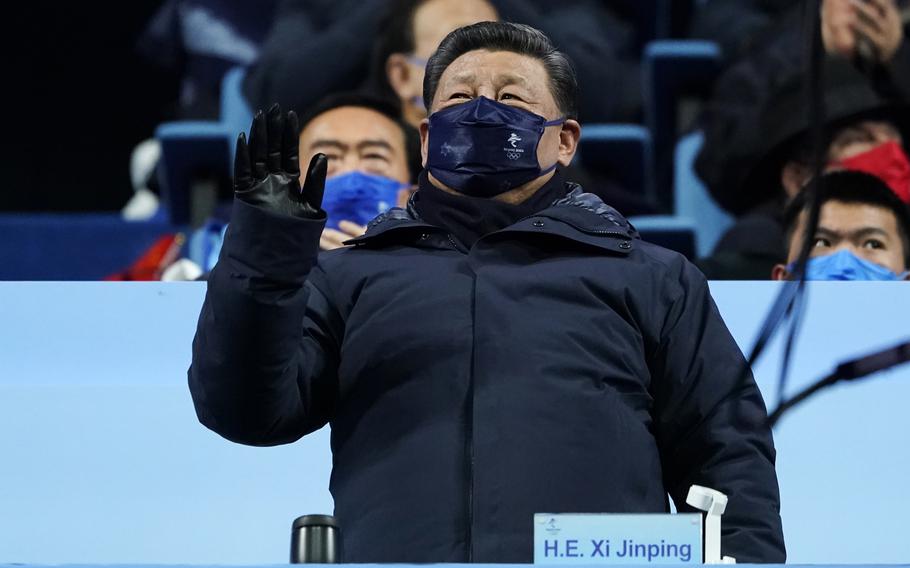 Chinese President Xi Jinping waves during the opening ceremony of the 2022 Winter Olympics, Friday, Feb. 4, 2022, in Beijing. (AP Photo/Jae C. Hong)