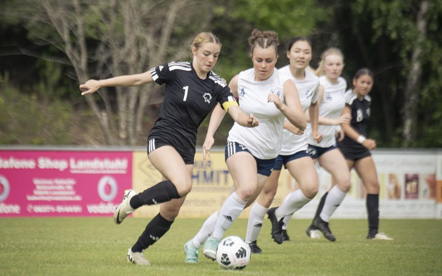 Maya Fitch, a senior with the Vicenza Cougars, attempts to break past defenders from the Black Forest Academy Falcons during the semifinals of the 2025 Division II DODEA European championships at Reichenbach-Steegen, Germany on May 21, 2025.