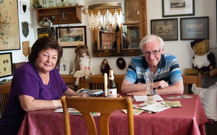 Blanca Knodel, tower keeper of the Blue Tower in Bad Wimpfen, Germany, left, and acquaintance Guenther Haberhauer pose for a photo at Knodel’s apartment inside the tower on July 6, 2023.