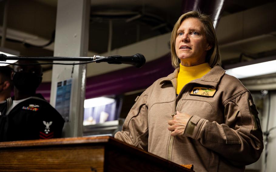 Capt. Amy Bauernschmidt, commanding officer of USS Abraham Lincoln, speaks on Nov. 11, 2021, during USS Abraham Lincoln’s 32nd commissioning anniversary and Veterans Day commemoration on the mess decks.