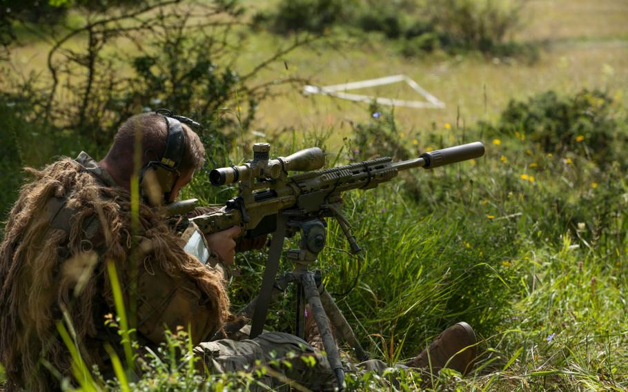 A U.S. soldier takes a firing position during the 2021 Best Sniper Team Competition at Hohenfels Training Area, Germany, Aug. 12, 2021. 