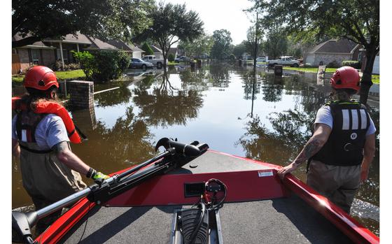 Beaumont, Texas, Sep. 2, 2017:  Megan McKee, left, of Fort Worth, Texas, and Anthony DiToma, of Dallas, pull a boat up a flooded street in a Beaumont, Texas neighborhood, after hurricane Harvey dropped historic amounts of rain in southeast Texas. McKee, a Navy veteran and DiToma, son of an Army vet, were participating in search and rescue with the veterans disaster relief non profit Team Rubicon.

Read Dianna Cahn's story on the Beaumont flooding and relief efforts here https://www.stripes.com/news/beaumont-slow-to-progress-as-help-pours-in-faster-than-water-recedes-1.485951

META TAGS: hurricane, climate change, Harvey, floods, environmental disaster, weather, U.S. Army, U.S. Navy, 