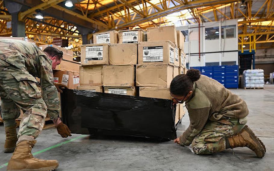 Members from the 39th Logistics Readiness Squadron at Incirlik Air Base, Turkey, assist humanitarian relief efforts by wrapping pallets containing a 52-bed emergency field hospital tent from U.S. charity Samaritan’s Purse, Feb. 11, 2023.