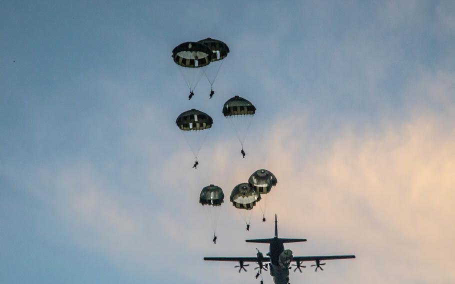 Soldiers from 1st Special Forces Group and members of the Japan Ground Self-Defense Forces Group parachute during a joint airborne operation on Andersen Air Force Base, Guam, July 30, 2021, during Exercise Forager 21.