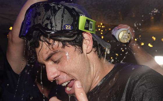 Milwaukee Brewers' Christian Yelich celebrates after clinching the National League Central Division after a baseball game against the St. Louis Cardinals Tuesday, Sept. 26, 2023, in Milwaukee. (AP Photo/Morry Gash)