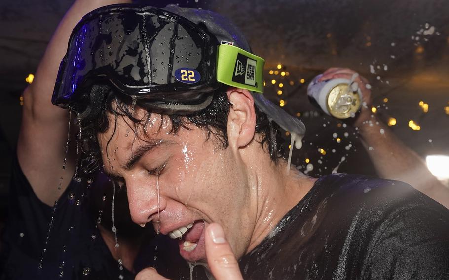Milwaukee Brewers’ Christian Yelich celebrates after clinching the National League Central Division after a baseball game against the St. Louis Cardinals Tuesday, Sept. 26, 2023, in Milwaukee. 