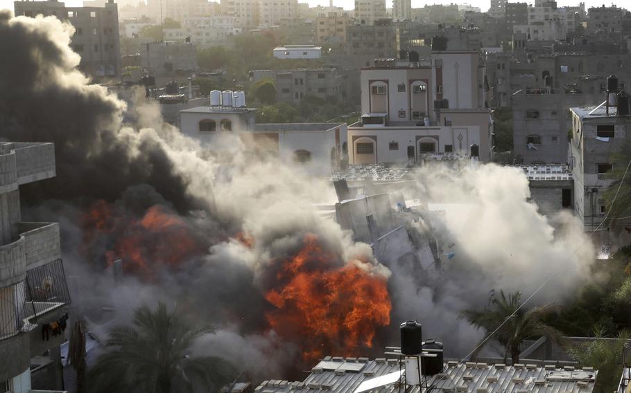 Smoke and fire rise from an explosion caused by an Israeli airstrike targeting a building in Gaza, Saturday, May 13, 2023. The building was owned by an Islamic Jihad official. 
