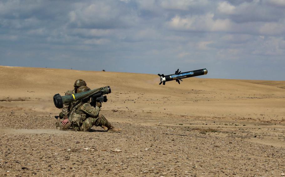 U.S. soldiers assigned to 2nd Platoon, Alpha Company, 1/163rd Combined Arms Battalion, launch a Javelin shoulder-fired anti-tank missile during an exercise in Syria on March 25, 2022. It could take seven years to restore U.S. inventories of 155mm precision-guided munitions, eight years to replace Javelin anti-tank missile systems and 18 years to replace Stinger surface-to-air missiles, according to a CSIS analysis of how long it would take at recent production rates to replenish weapon inventories.